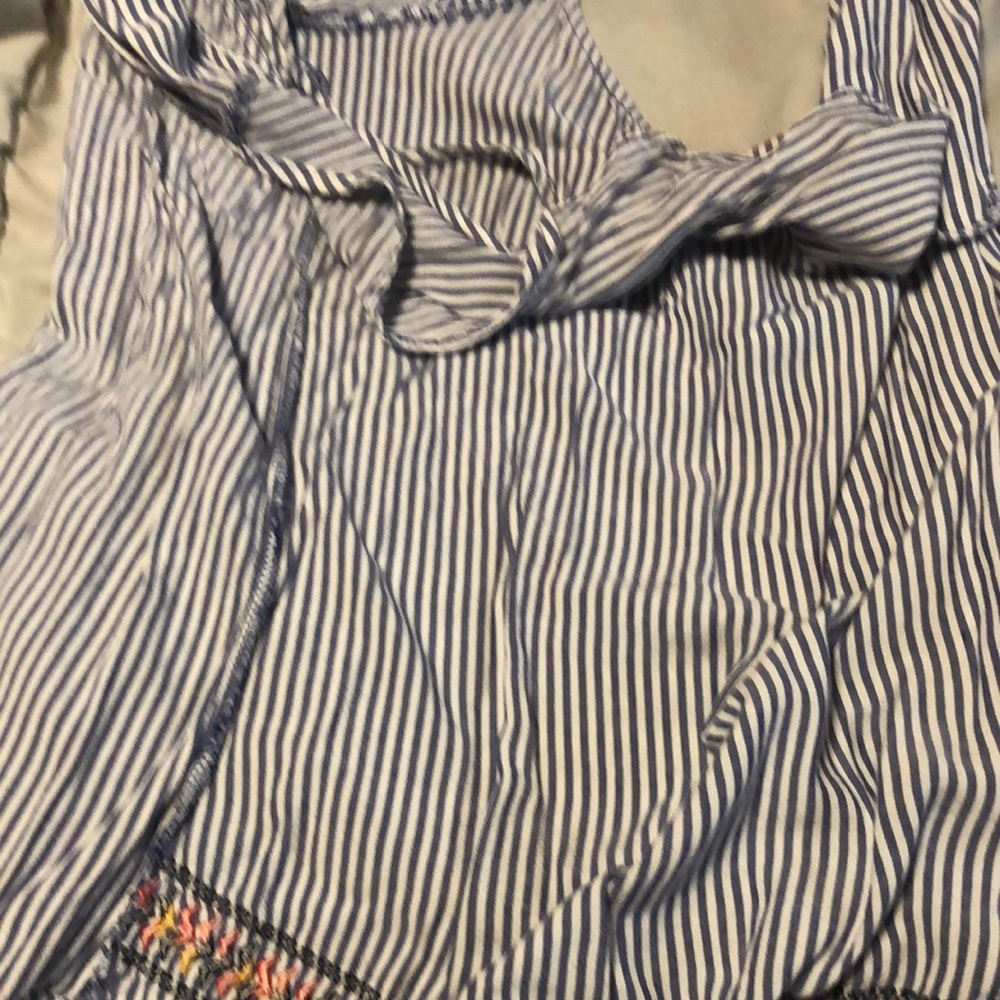 This is a Rue 21 cute dressy striped shirt with tribal print on the bottom